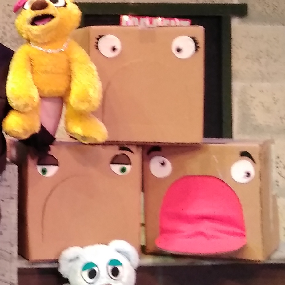 A pile of three square cardboard boxes, each with big cartoony eyes, one has a large open mouth lined with red fabric. Picture links to project page.