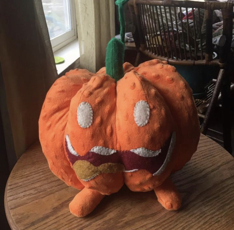 A large orange pumpkin shaped plush with a sewn-on face. Picture links to project page.